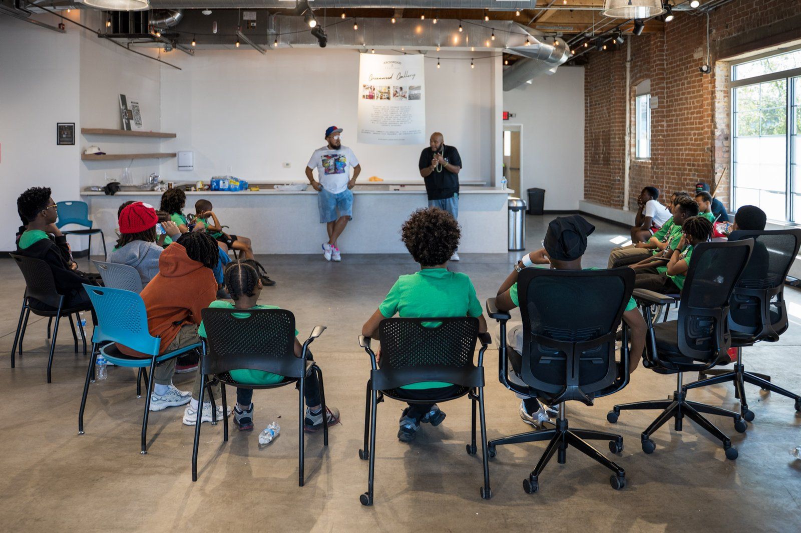 Mentees seated in a circle during a workshop session
