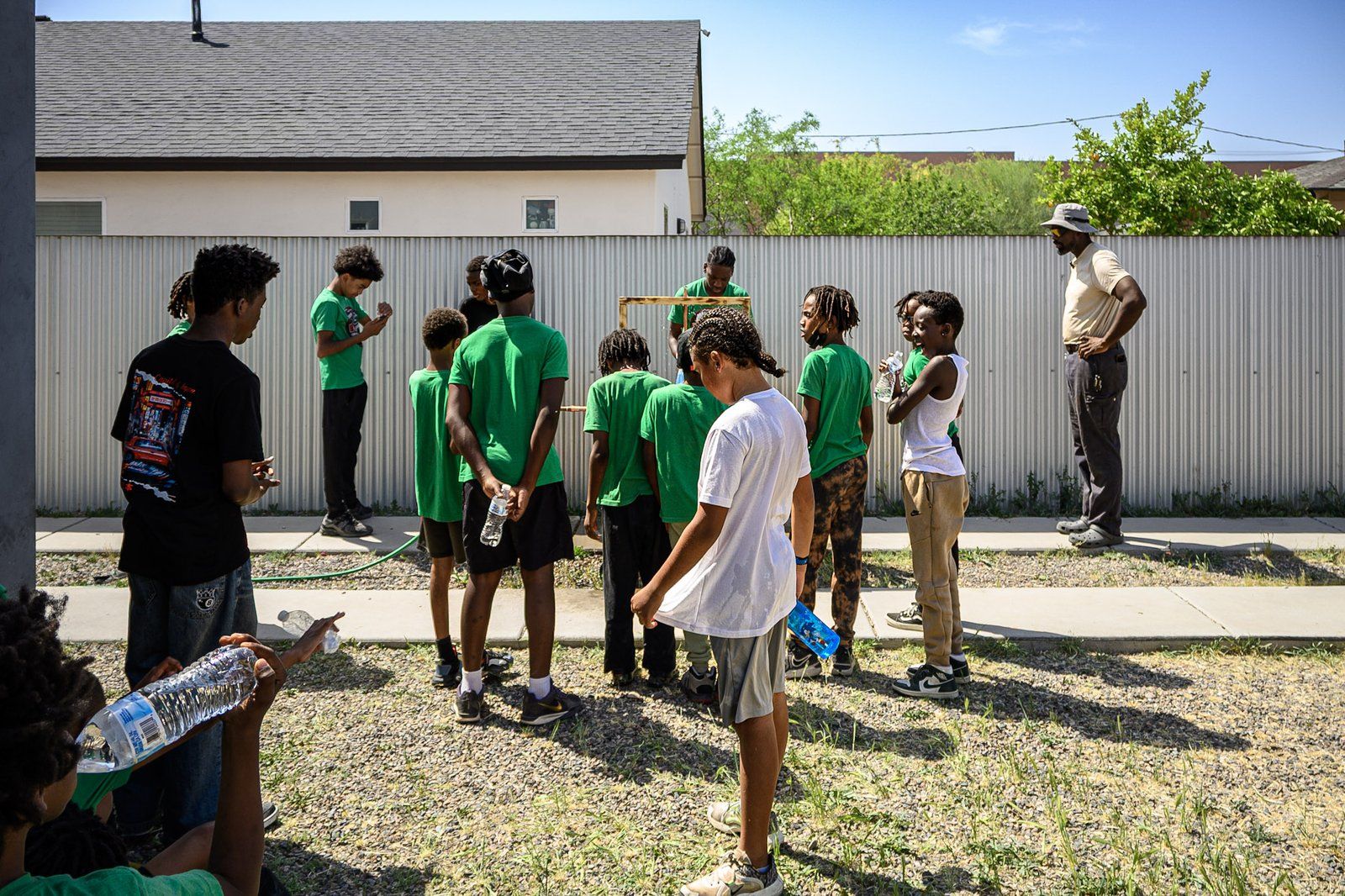 Mentees and mentors gathered outdoors during a program session