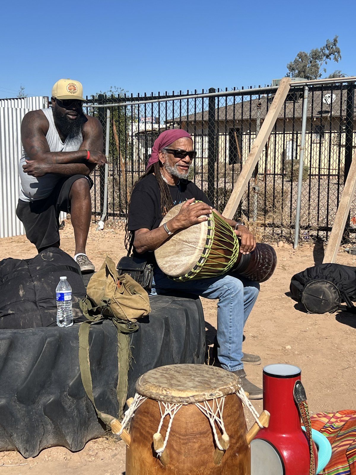 A drummer playing during an outdoor rites of passage session