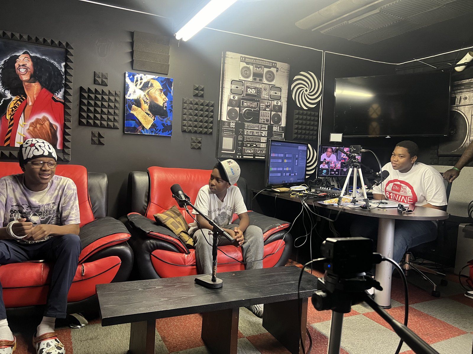 Mentees recording in a podcast studio