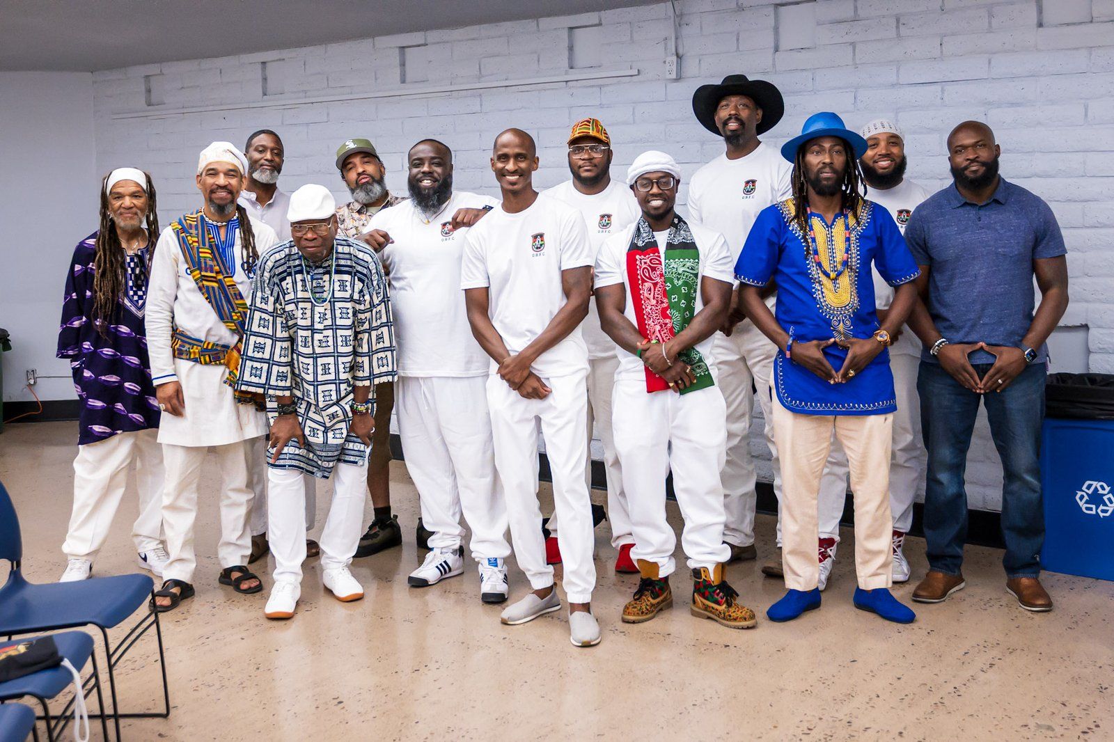 Mentors and community leaders posed together in white