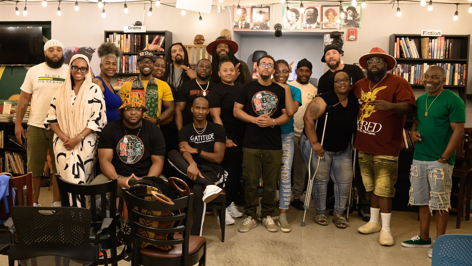 A large group of fathers, mentors, and mentees at a community event