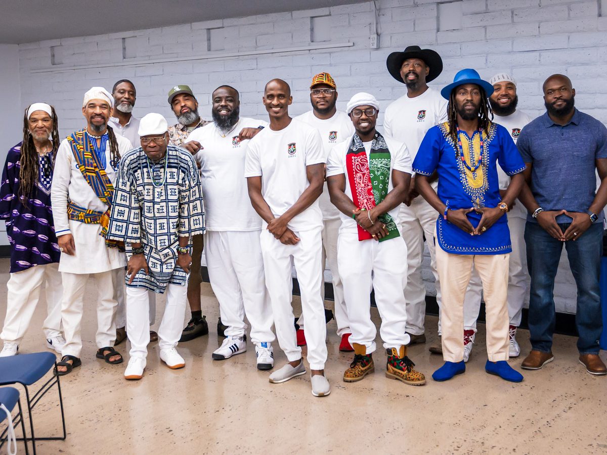 Members of the OBFC community in ceremonial dress at a cultural gathering.